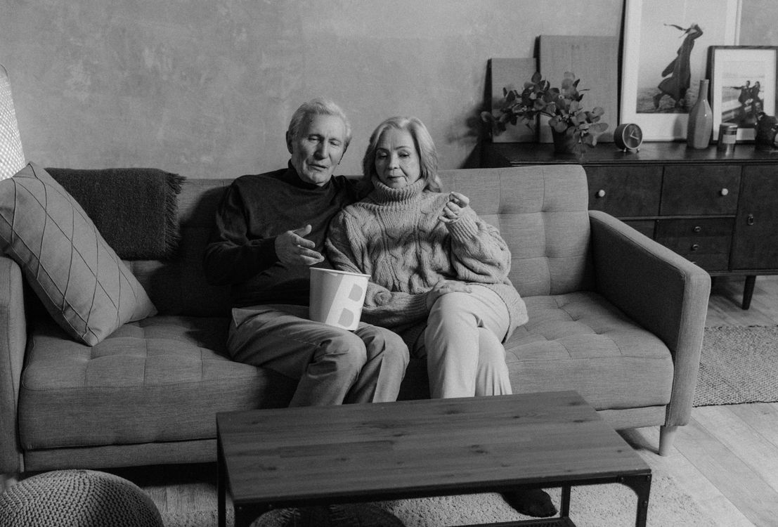 Caregiver spending time with a senior parent experiencing memory changes at home