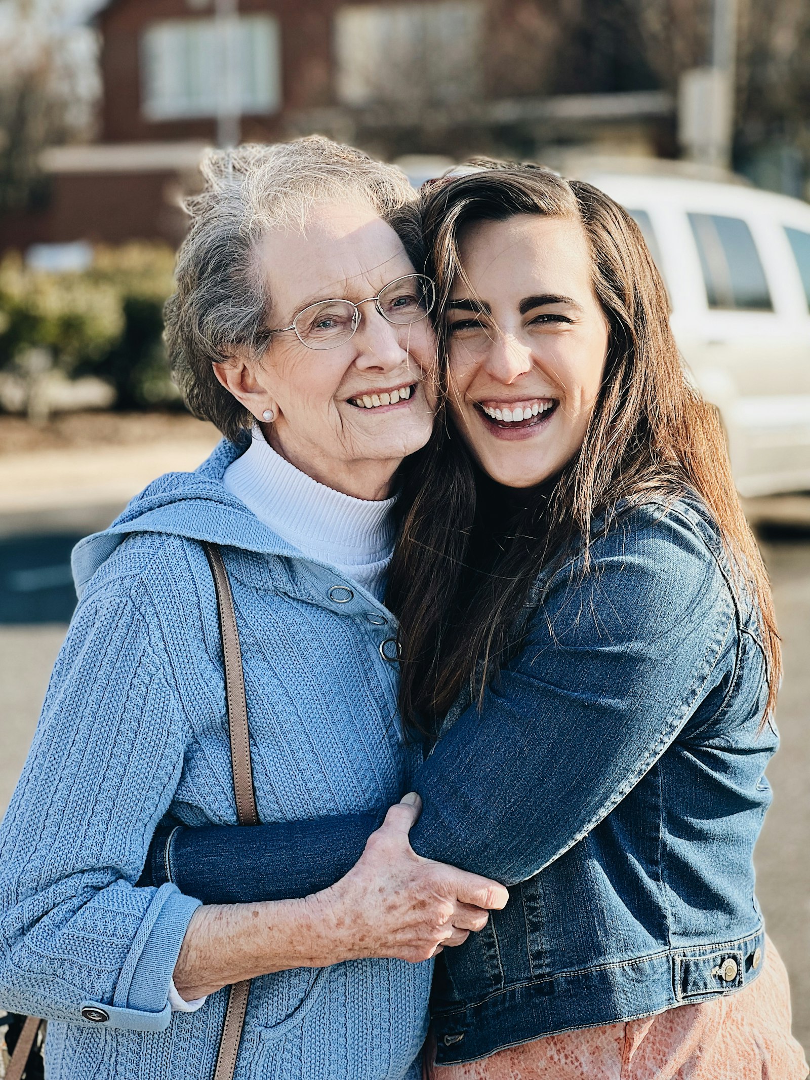Home - in-home care san diego - adult daughter hugging her mother during a visit 1 Adult daughter hugging her mother during a Labor Day visit