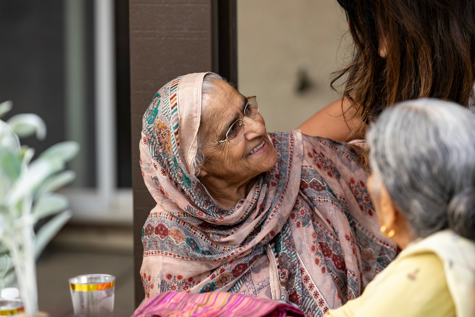 Home - in-home care san diego - caregiver and senior woman smiling together at home Caregiver and senior woman smiling together at home
